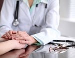 Doctor holding patient's hands