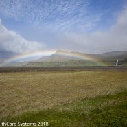 Iceland field rainbow
