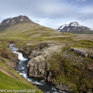 Stream through hills Iceland